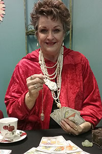 photo of a fortune teller with cards